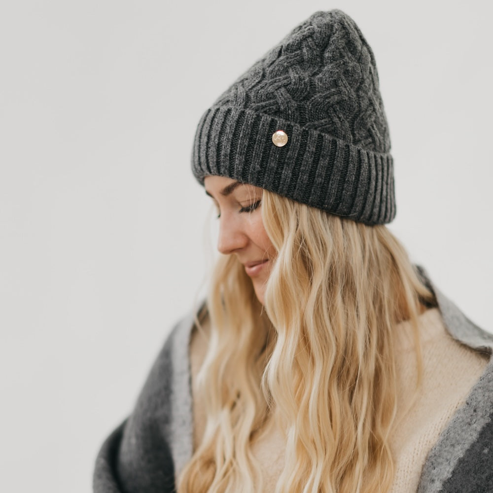 Charcoal cashmere beanie with satin lining and knit cuff detail with button