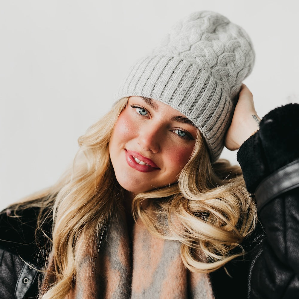 Light gray cashmere beanie with satin-lined cuff and cable knit crown