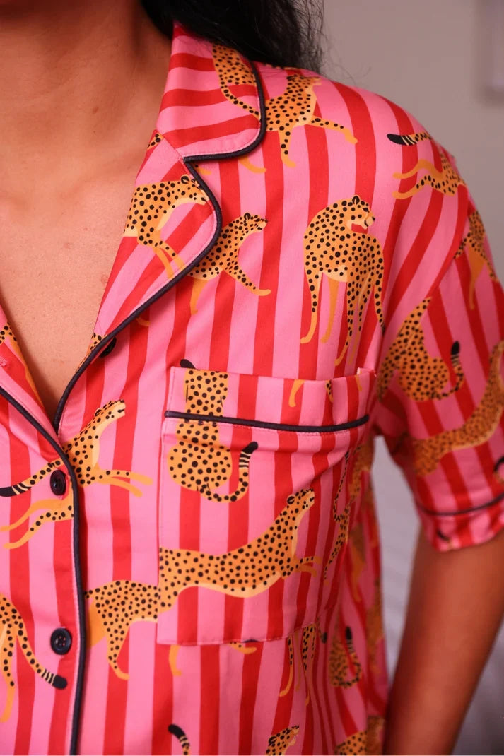 Pink striped pajama shirt with leopard print, open collar, and button placket