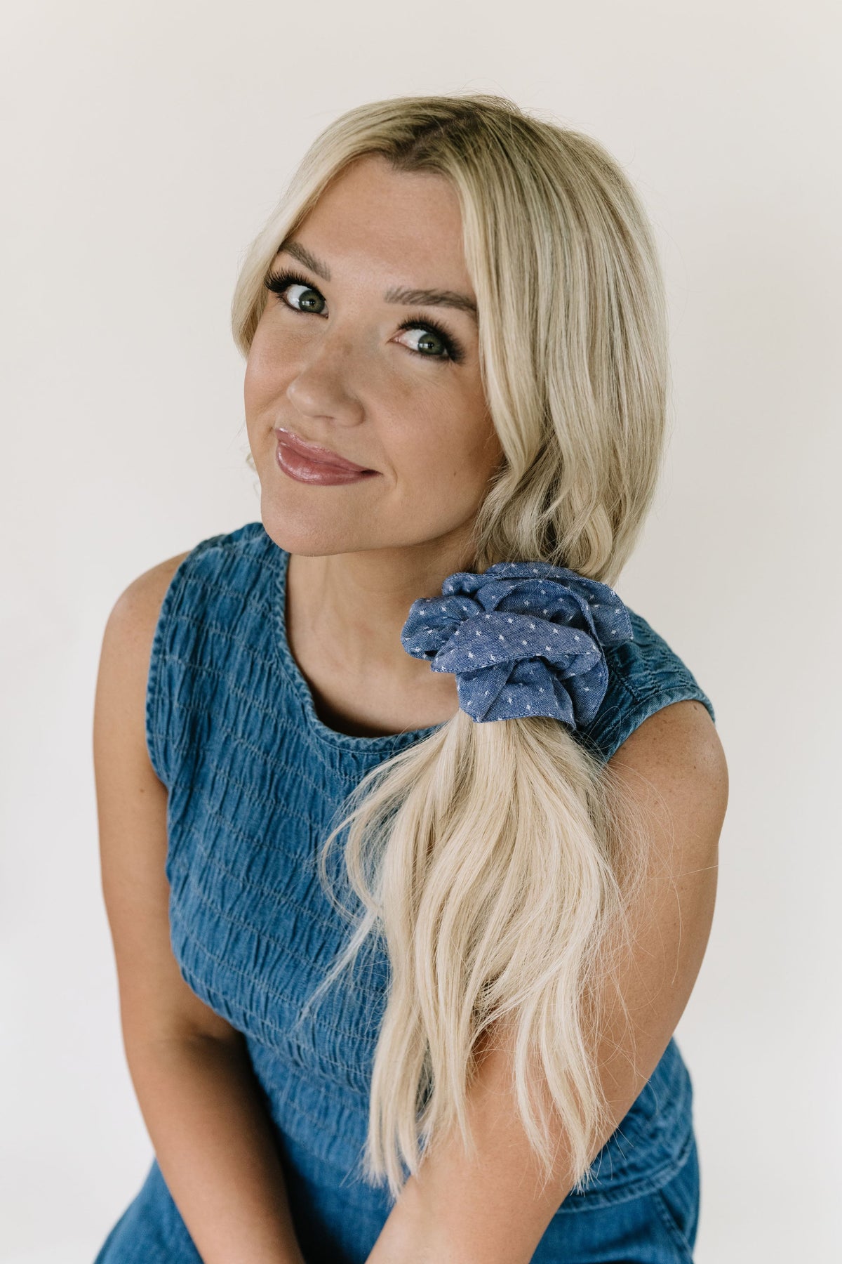 Blue patterned hair scrunchie on blonde hair