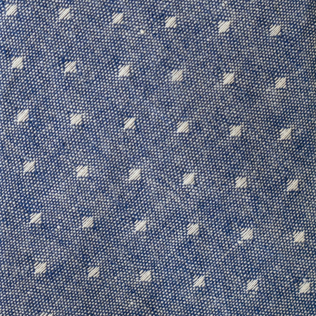 Close-up blue fabric with small light square pattern