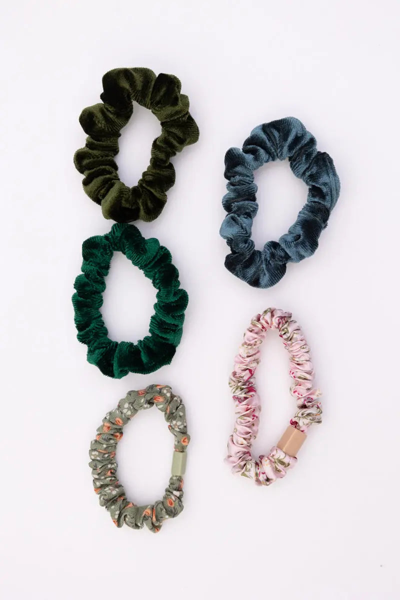 Four hair scrunchies: olive green, blue, gray patterned, and pink floral
