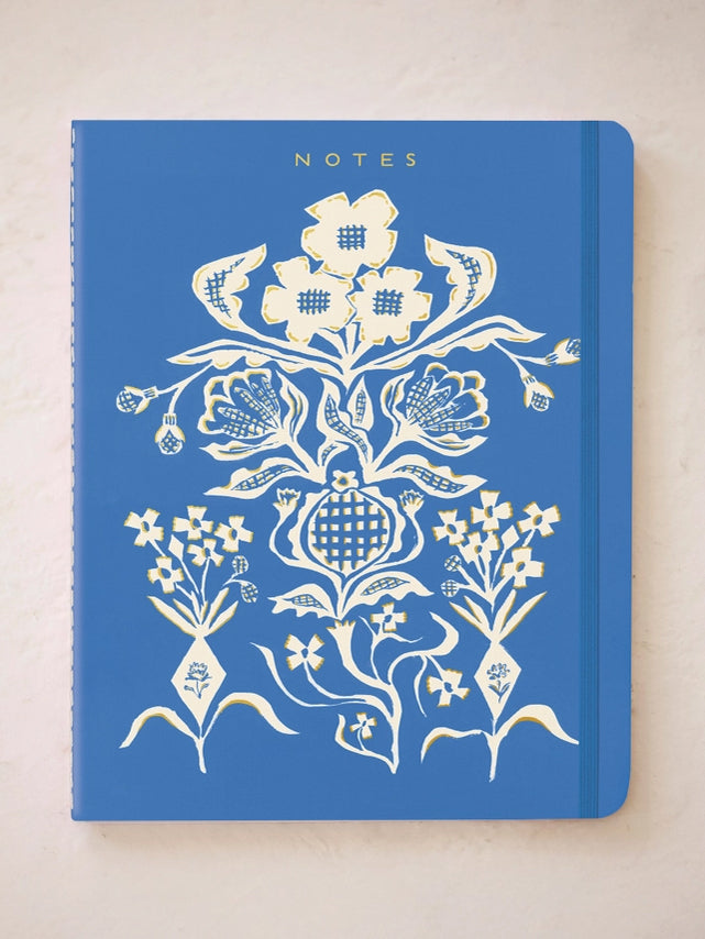 Blue floral notes notebook with ornate bouquet design on the cover