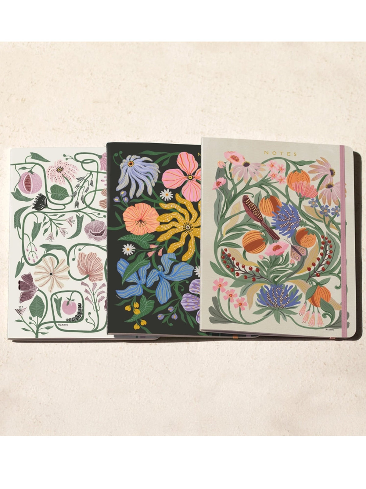 Trio notebook set with three stitched floral covers: white, dark, and light pink palettes
