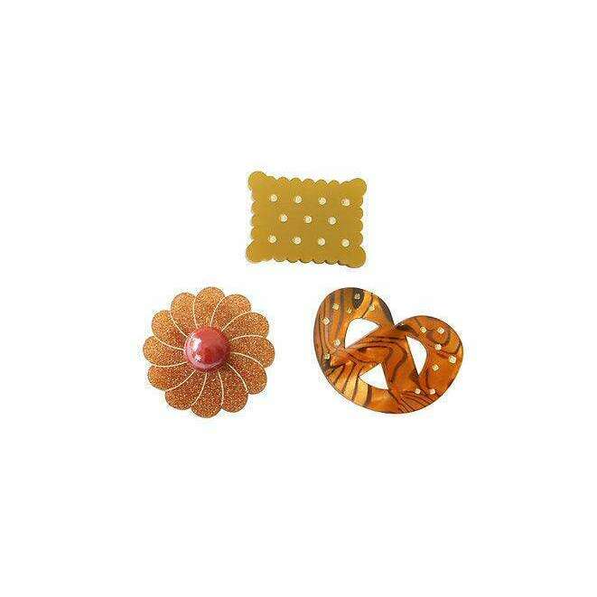 Cookie brooch set with yellow dotted rectangle, orange flower, and tiger heart