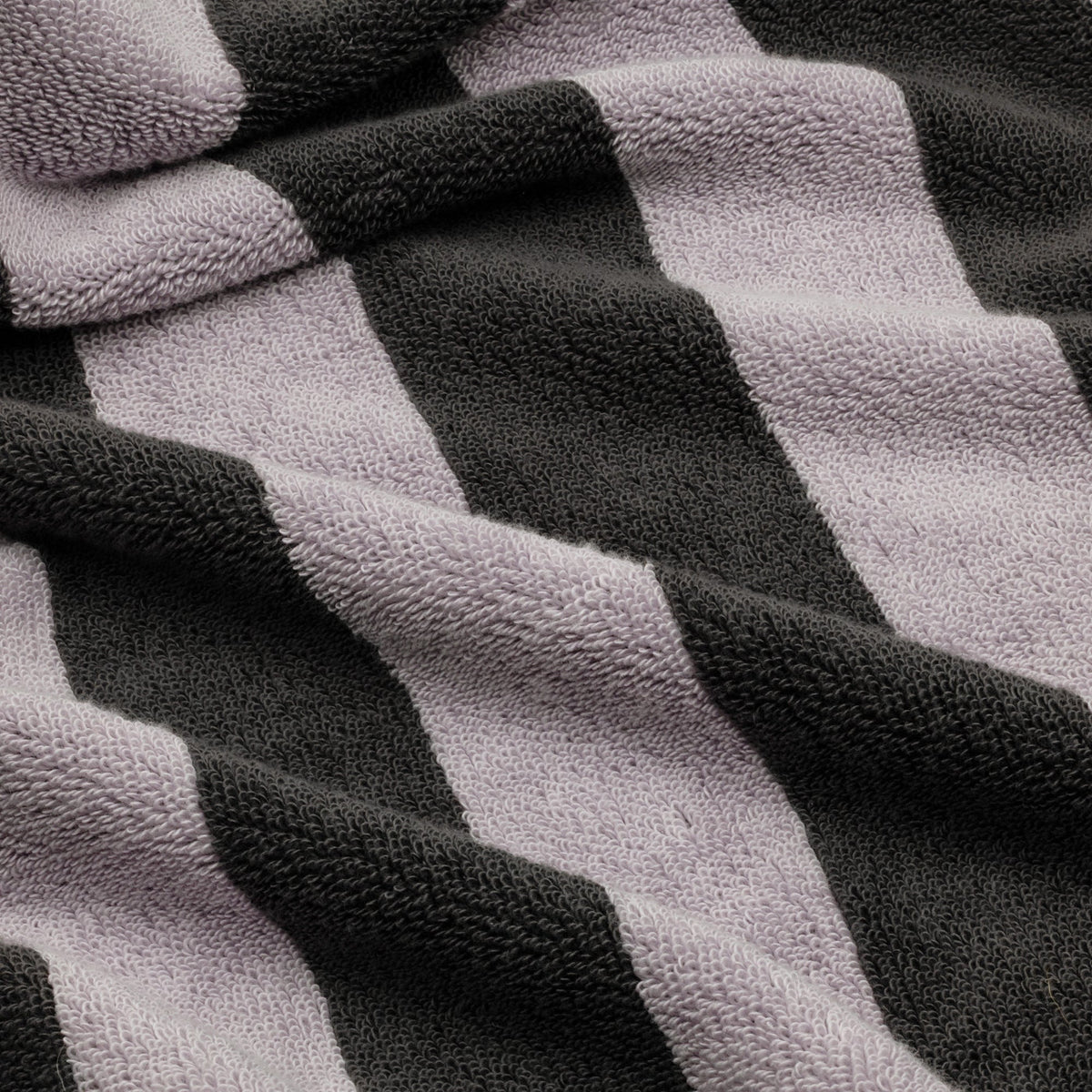 Close-up of cotton towel weave with light gray and dark charcoal checks