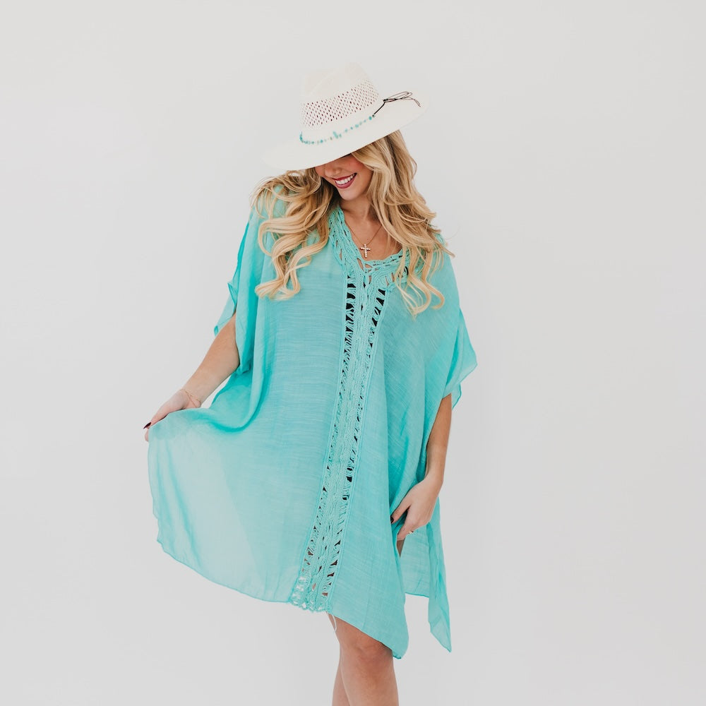White western sun hat with perforated crown and turquoise beaded edge.