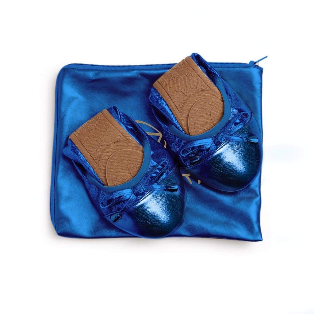 Pair of cobalt blue metallic flats with matching blue storage pouch