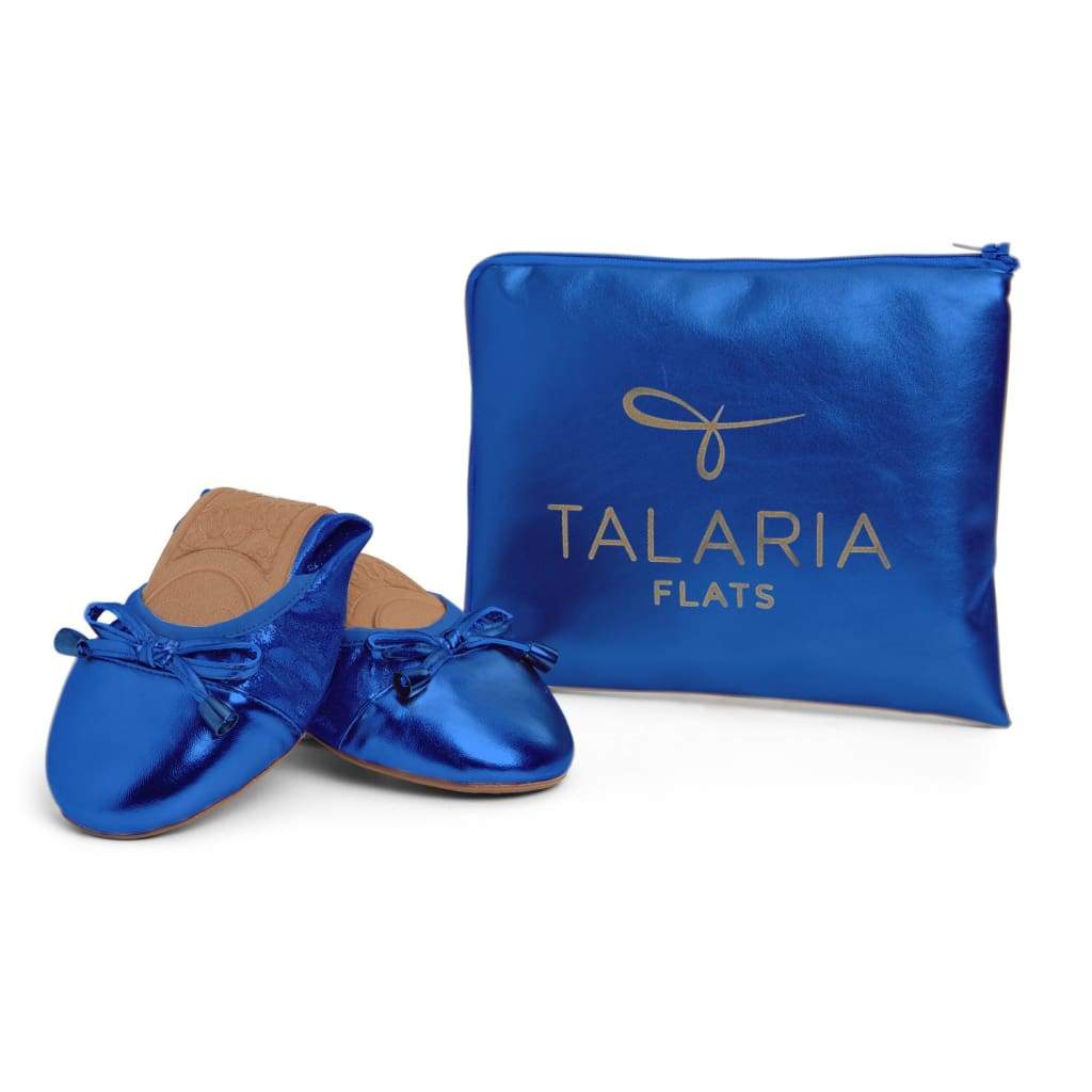 Cobalt blue metallic flats with TALARIA FLATS branded storage pouch