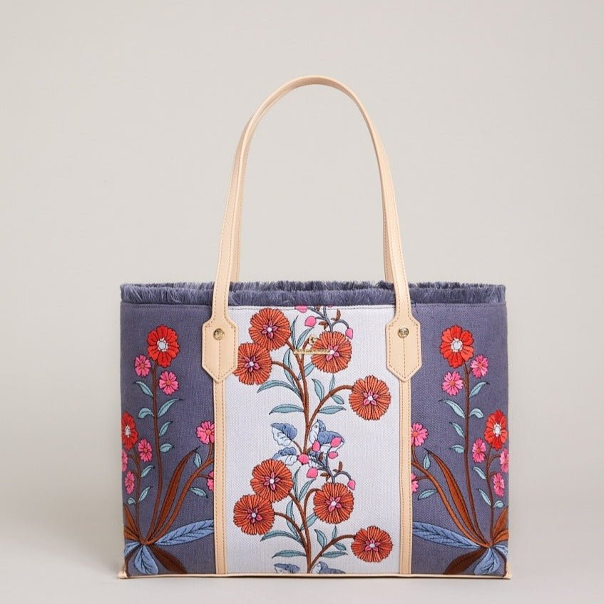 Navy floral embroidered shopper tote with cream center panel and tan leather handles