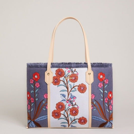 Navy floral embroidered shopper tote with cream center panel and tan leather handles