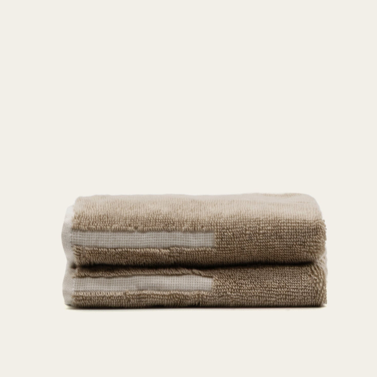 Sorrel Australian cotton towels in taupe-tan, folded stack