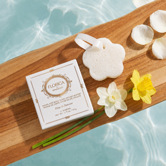 Travel-size body wash buffer sponge by Florica with box, daffodil and white flowers