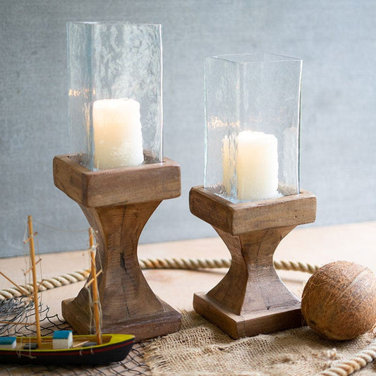 Set of two square glass hurricane candle holders with recycled wood bases and candles