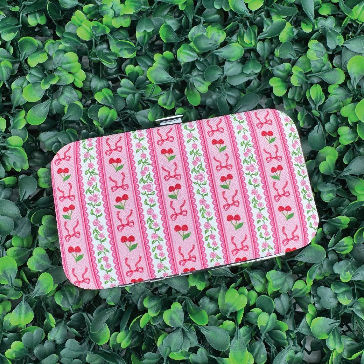 Manicure travel kit case, pink striped with cherry and bow pattern.