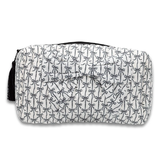 Quilted bow cosmetic bag in black and white with bow-shaped front detail