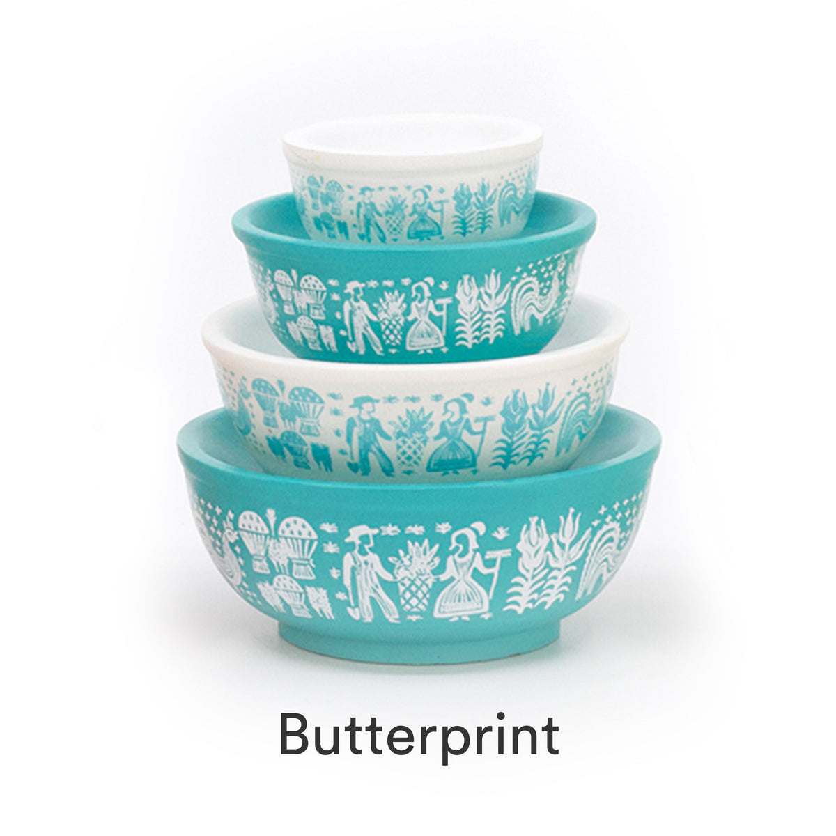 Mini stackable mixing bowl set with teal animal-and-tree pattern on white and teal bowls.