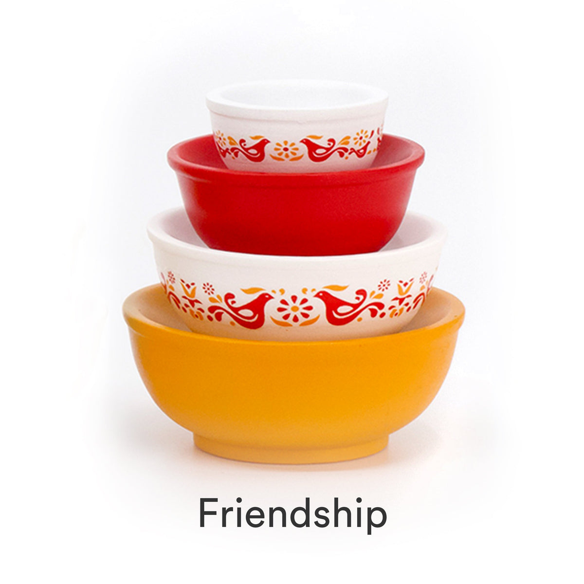 Mini stackable mixing bowl set with red swirls on white bowls and a red base bowl.