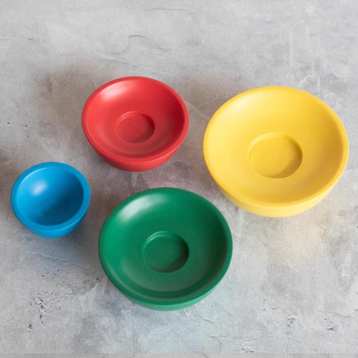 Stackable mini mixing bowls, assorted colors: red, yellow, blue, and green
