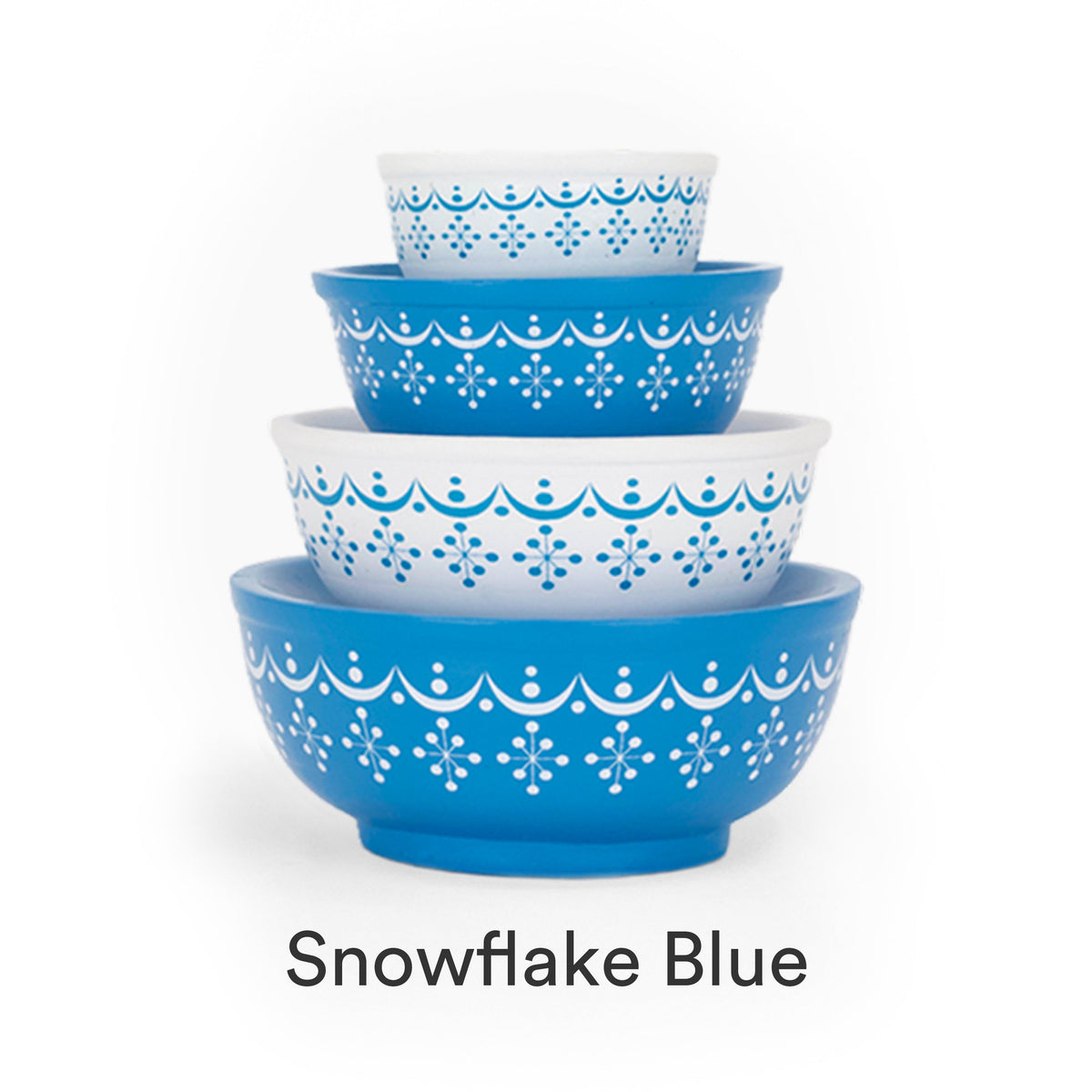 Mini stackable mixing bowl set with blue scallop and snowflake pattern on blue bowls.