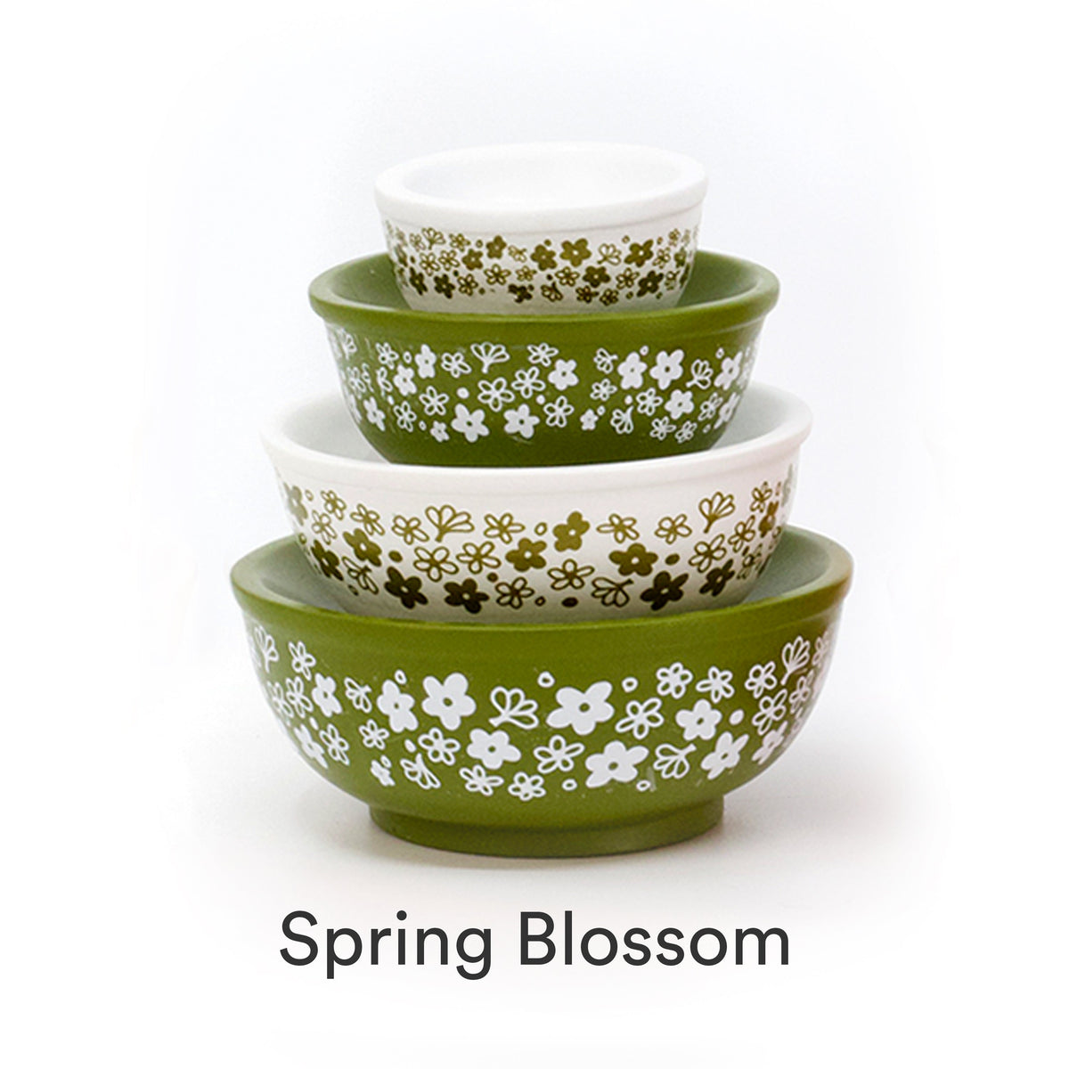 Mini stackable mixing bowl set with small white flower pattern on olive and white bowls.
