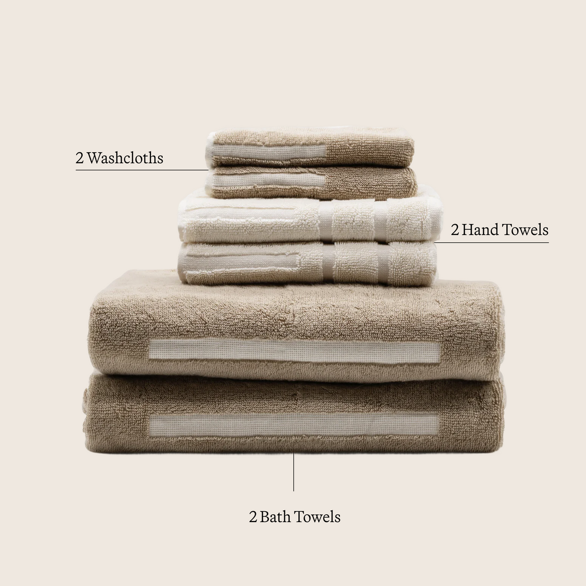 Stack of tan and ecru cotton towels with striped bands, neatly folded set