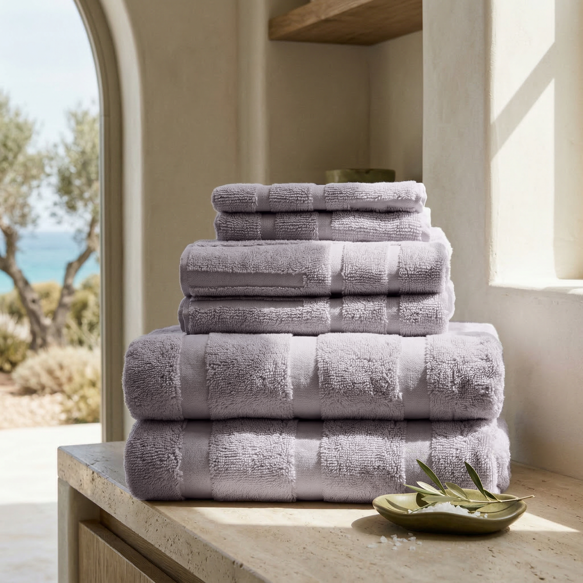Australian cotton towels, lilac, stacked in a neat pile