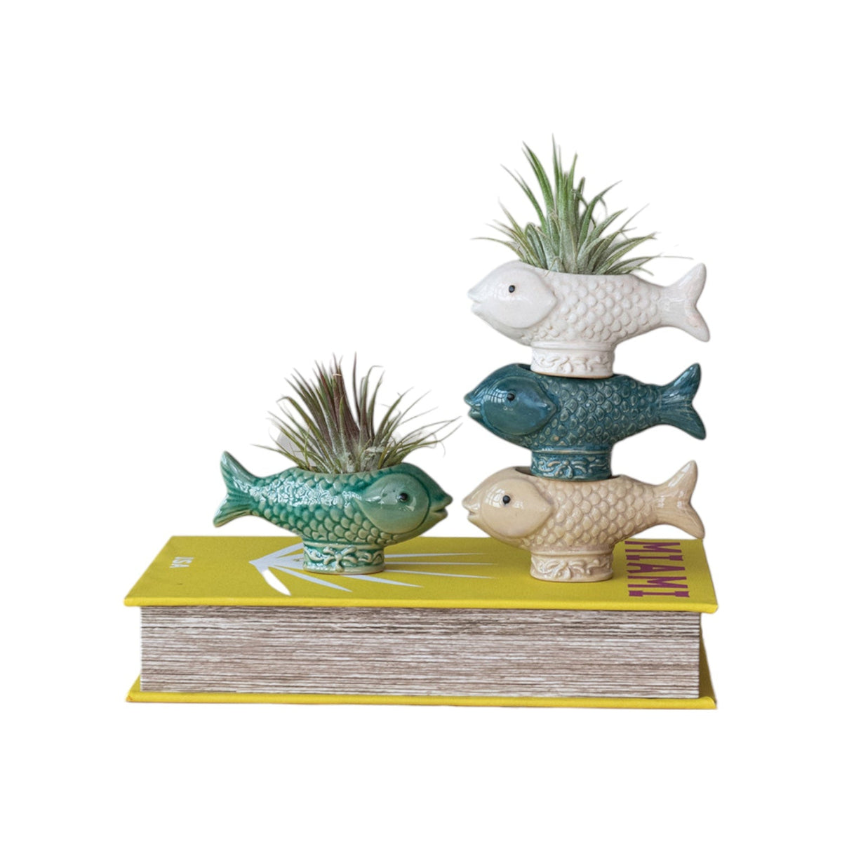 Reactive glaze fish toothpick holder set: blue, green, and tan fish with plants.