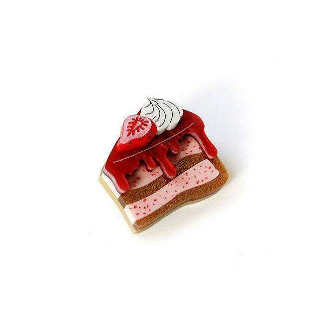 Strawberry cake brooch pin with red top and cream filling in a wedge