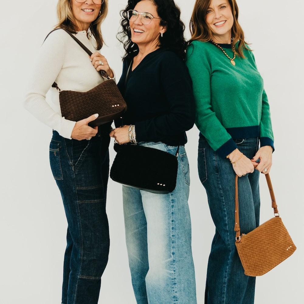 Woven suede hobo shoulder bags on models in dark and tan tones