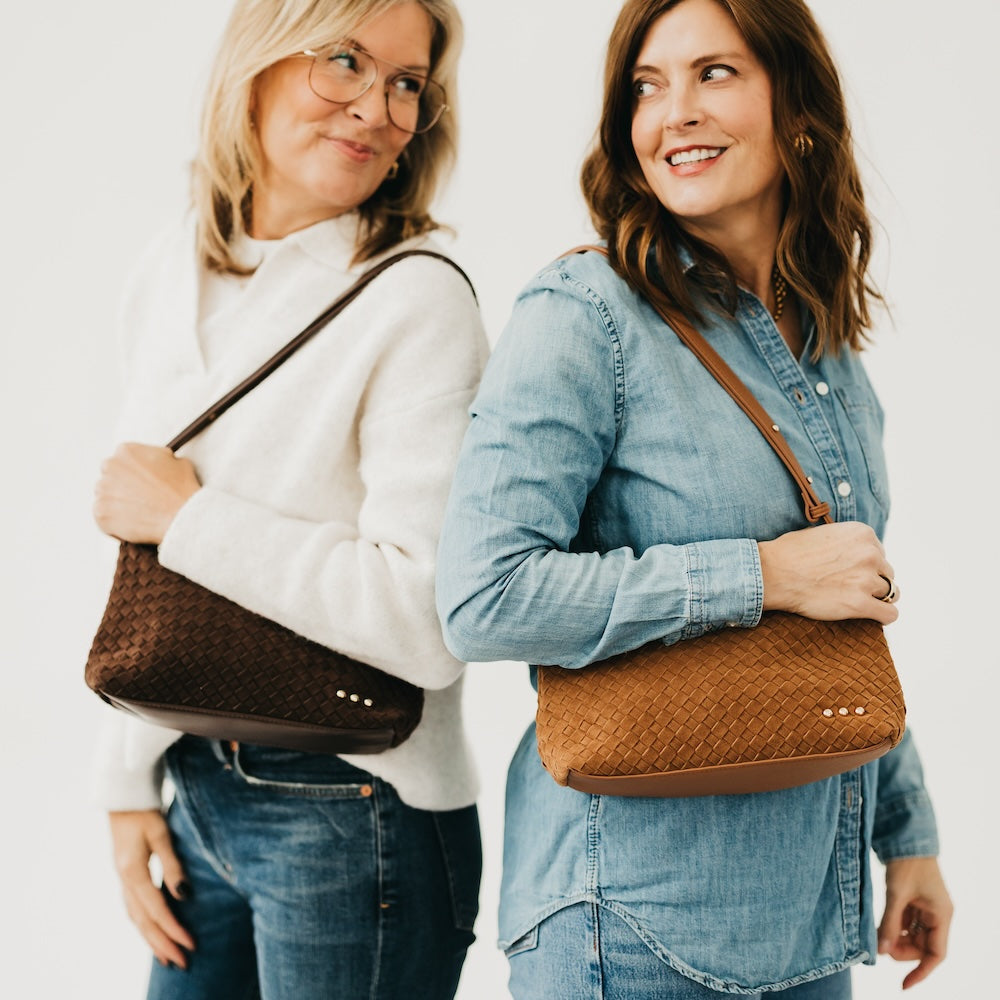 Woven suede hobo shoulder bag with braided strap and gold snap details