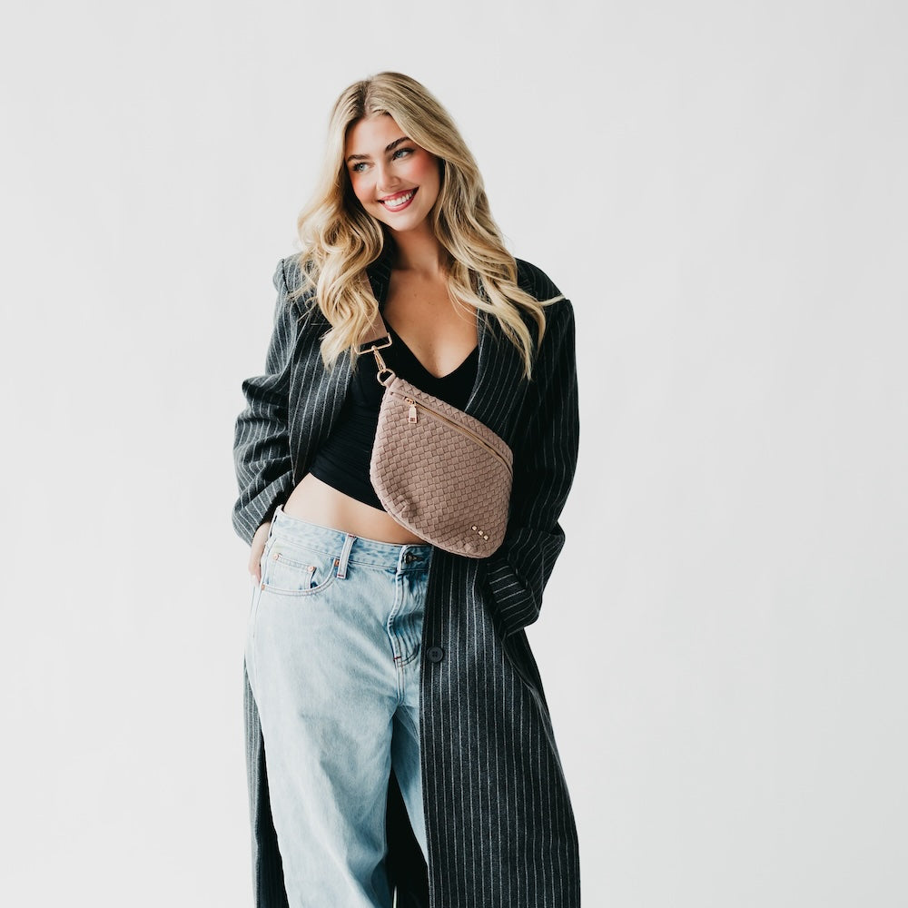 Mocha brown woven suede bum bag with top zipper, gold-tone hardware, and studs