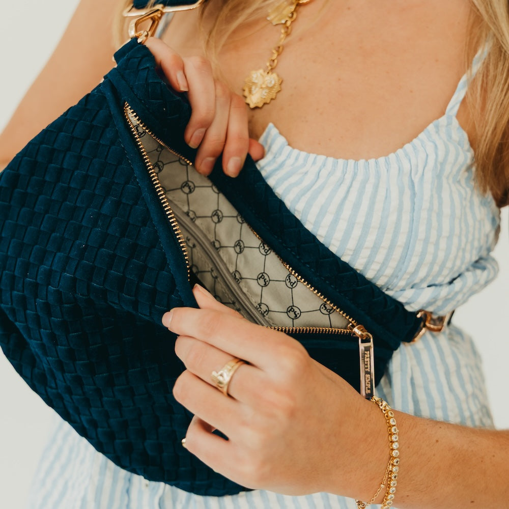 Teal woven suede bum bag with gold-tone zip and adjustable strap