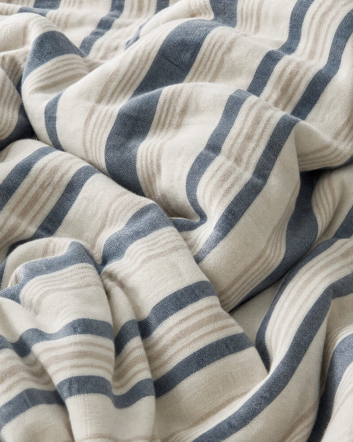 Reversible cotton duvet cover fabric, cream with blue wavy stripe bands