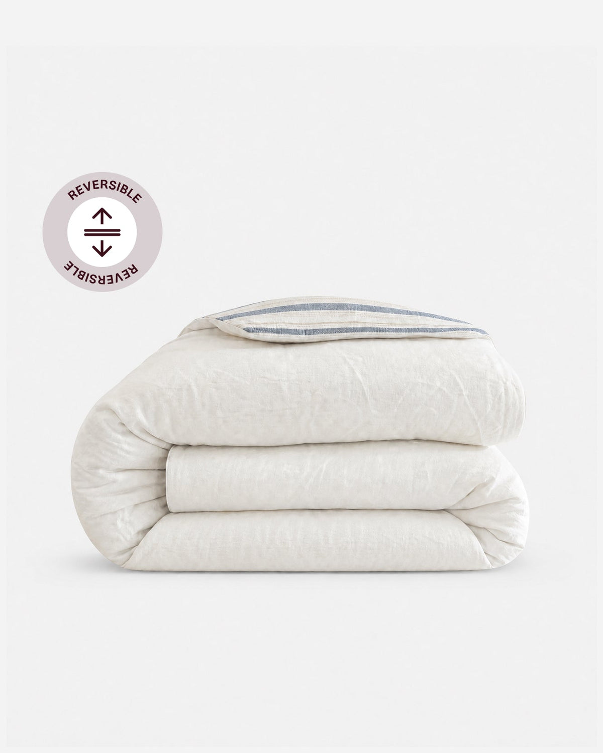 Reversible cotton duvet cover, solid off-white plain side, folded for display