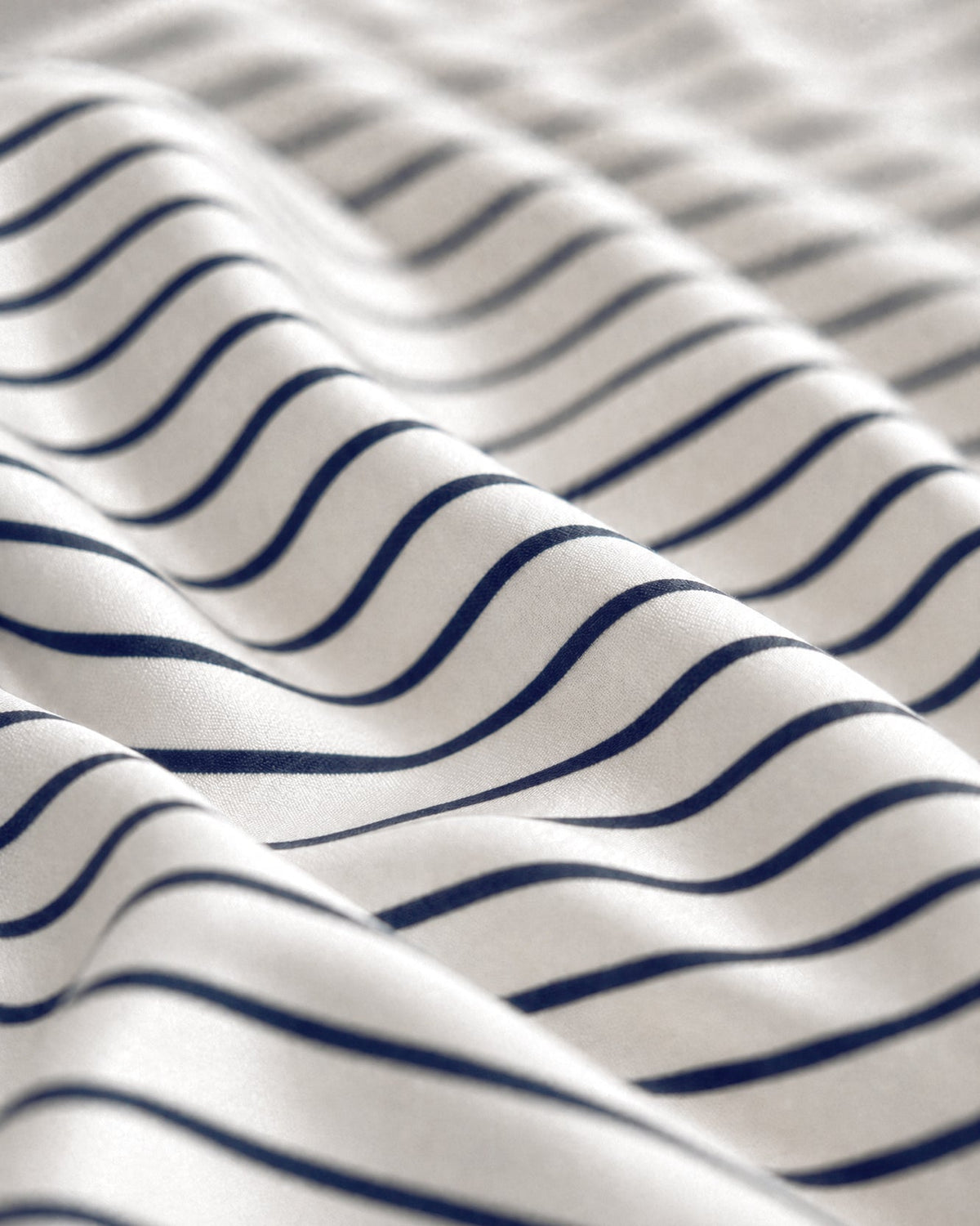 Wavy striped fabric detail in white with dark blue lines