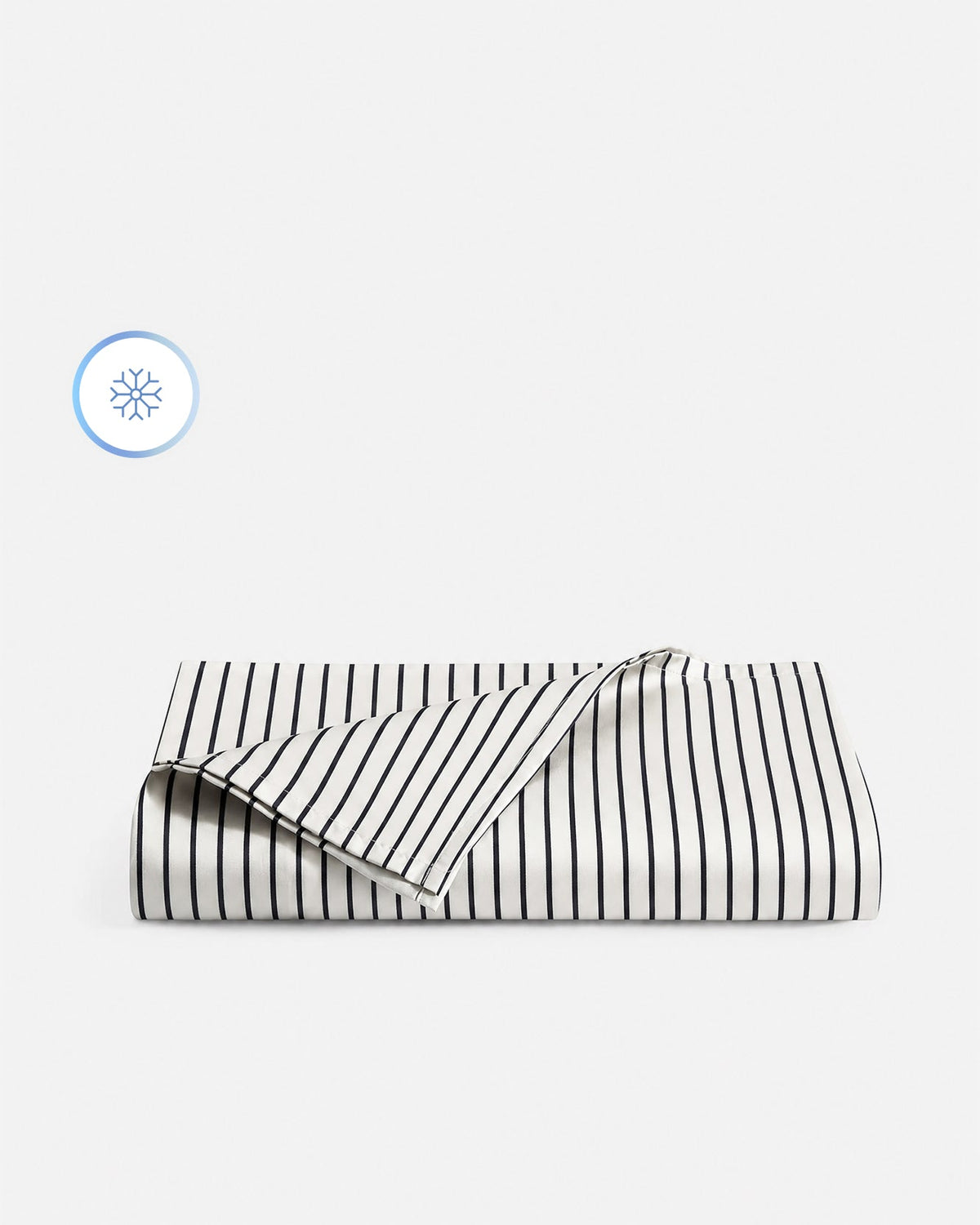 Striped white and dark blue cooling top sheet, folded view with overlapping corner