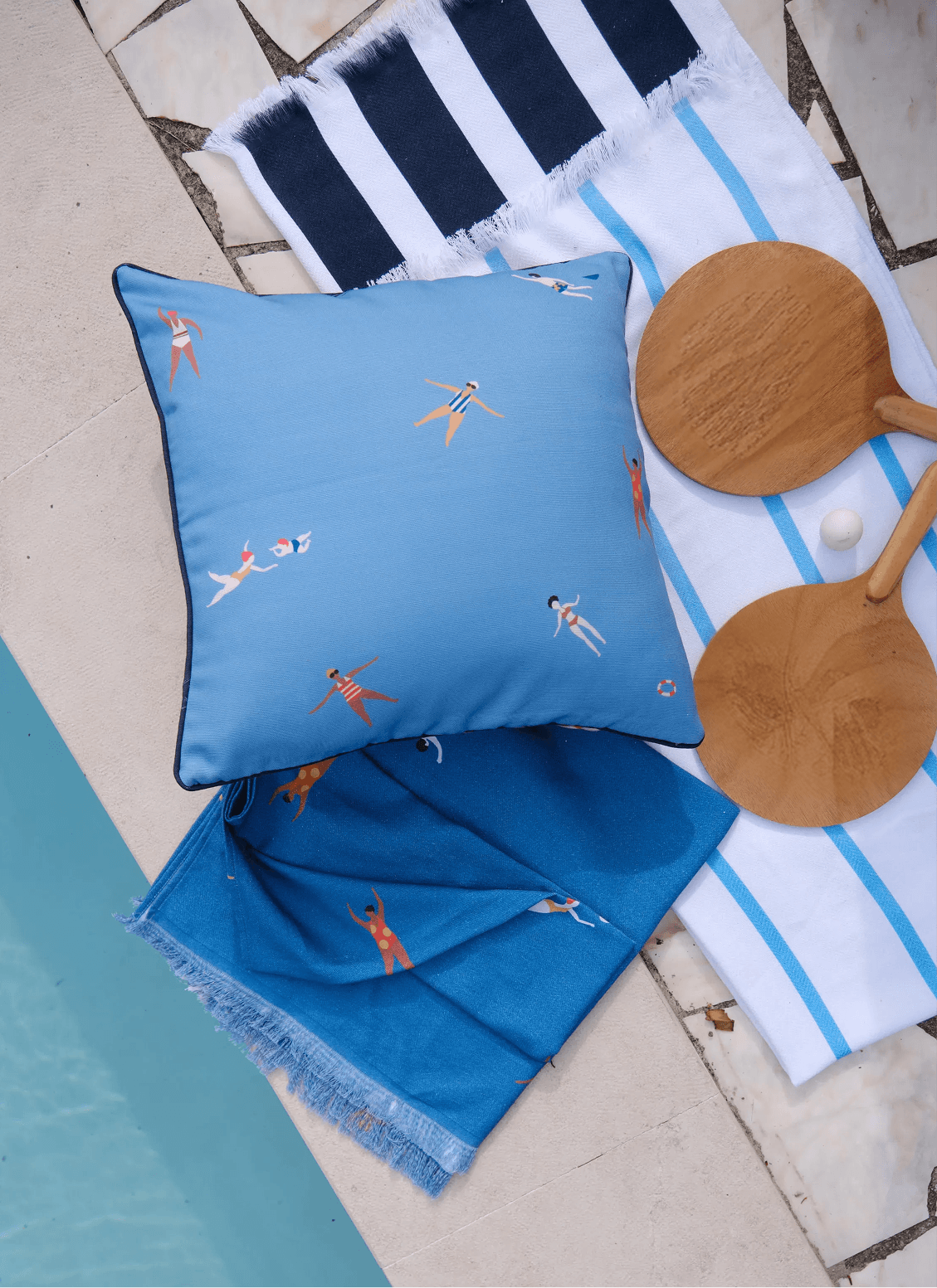Blue beach blanket with light-blue stripes and fringed border