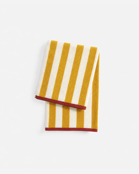 Reversible beach towel, ochre and white vertical stripes with red border