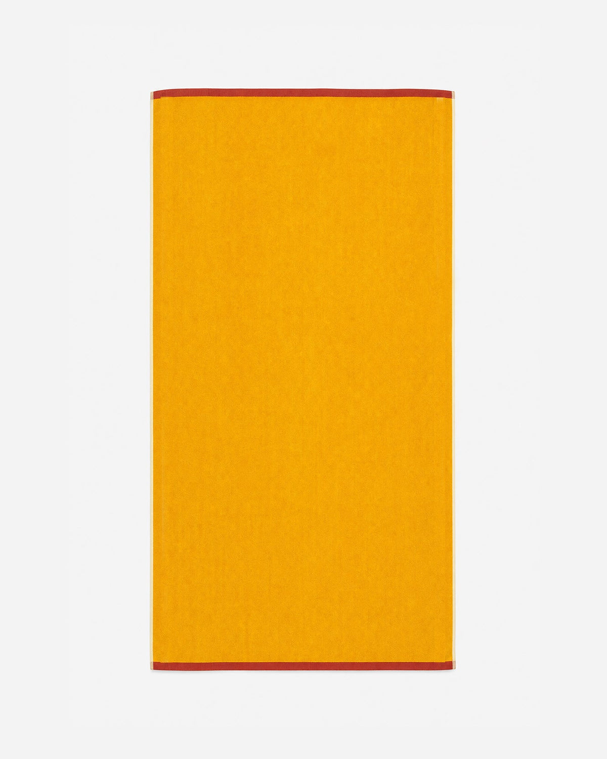Reversible beach towel, solid ochre with red trim along the edges