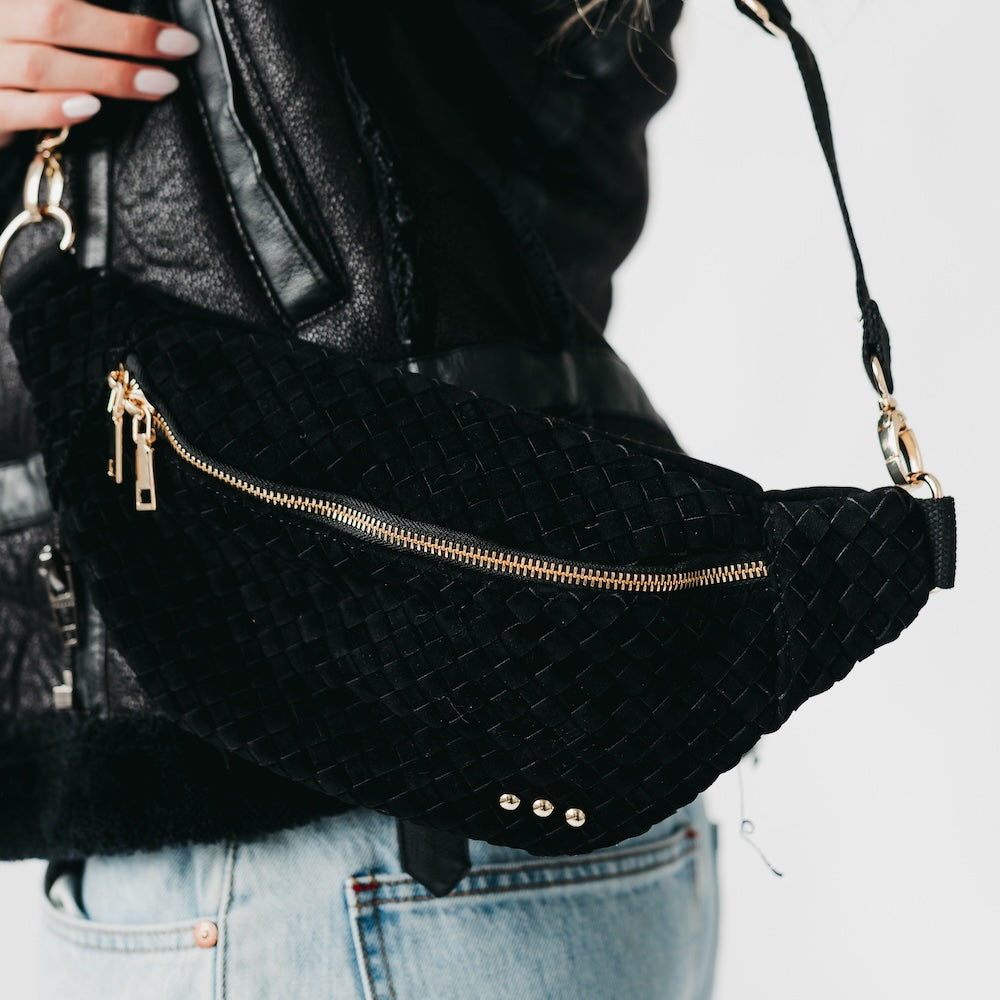 Woven suede bum bag in black with long zipper and gold-tone hardware details.