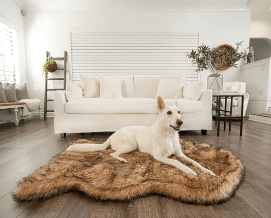 Sable tan faux fur orthopedic dog bed with curved shag surface for lounging.