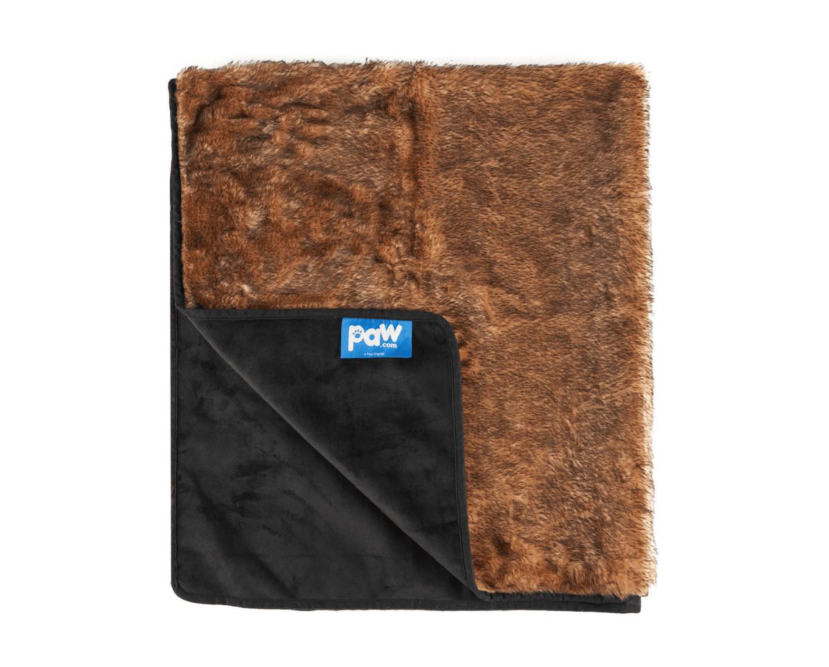 Folded sable tan and dark pet blanket with paw logo tag and black backing