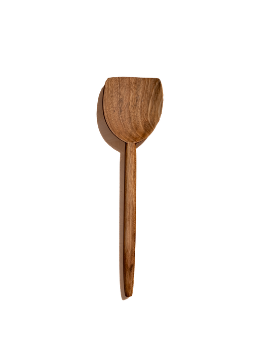 Walnut curved wooden spatula with a rounded head and long handle.