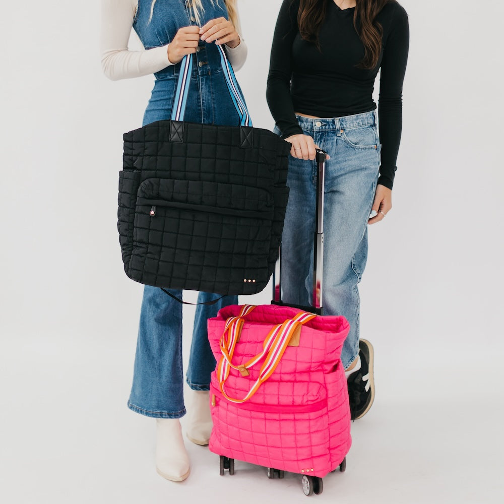 Black quilted tote roller bag and pink rolling tote bag with wheels