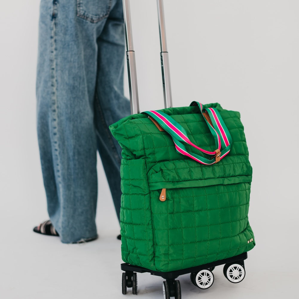 Green quilted tote roller bag with wheels and striped handle
