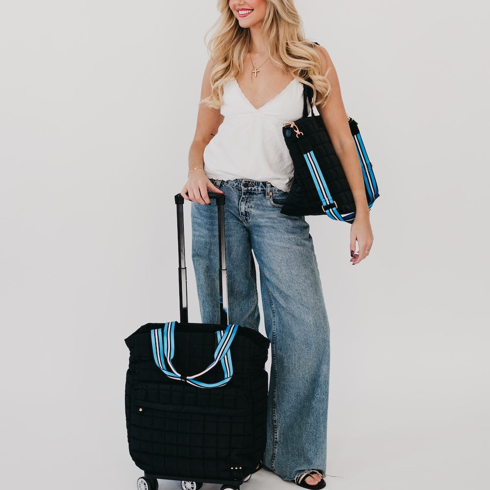 Black quilted tote roller bag with wheels and telescoping handle