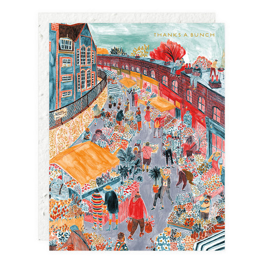 Colorful illustrated greeting card with city street scene and text "THANKS A BUNCH"