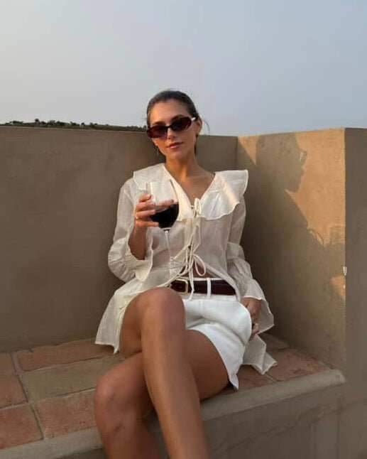 Ivory ruffle top with V-neck and long balloon sleeves