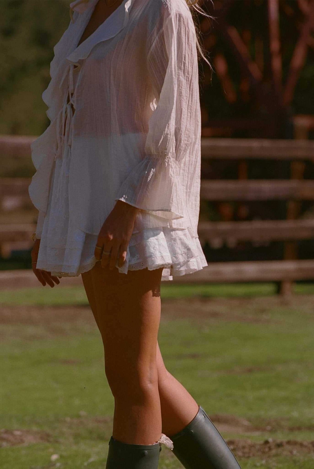 Ivory ruffle blouse top with long sleeves and layered short hem